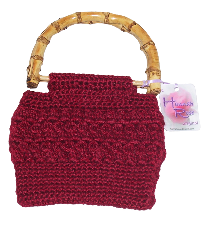 burgundy crocheted handbag with bamboo handles